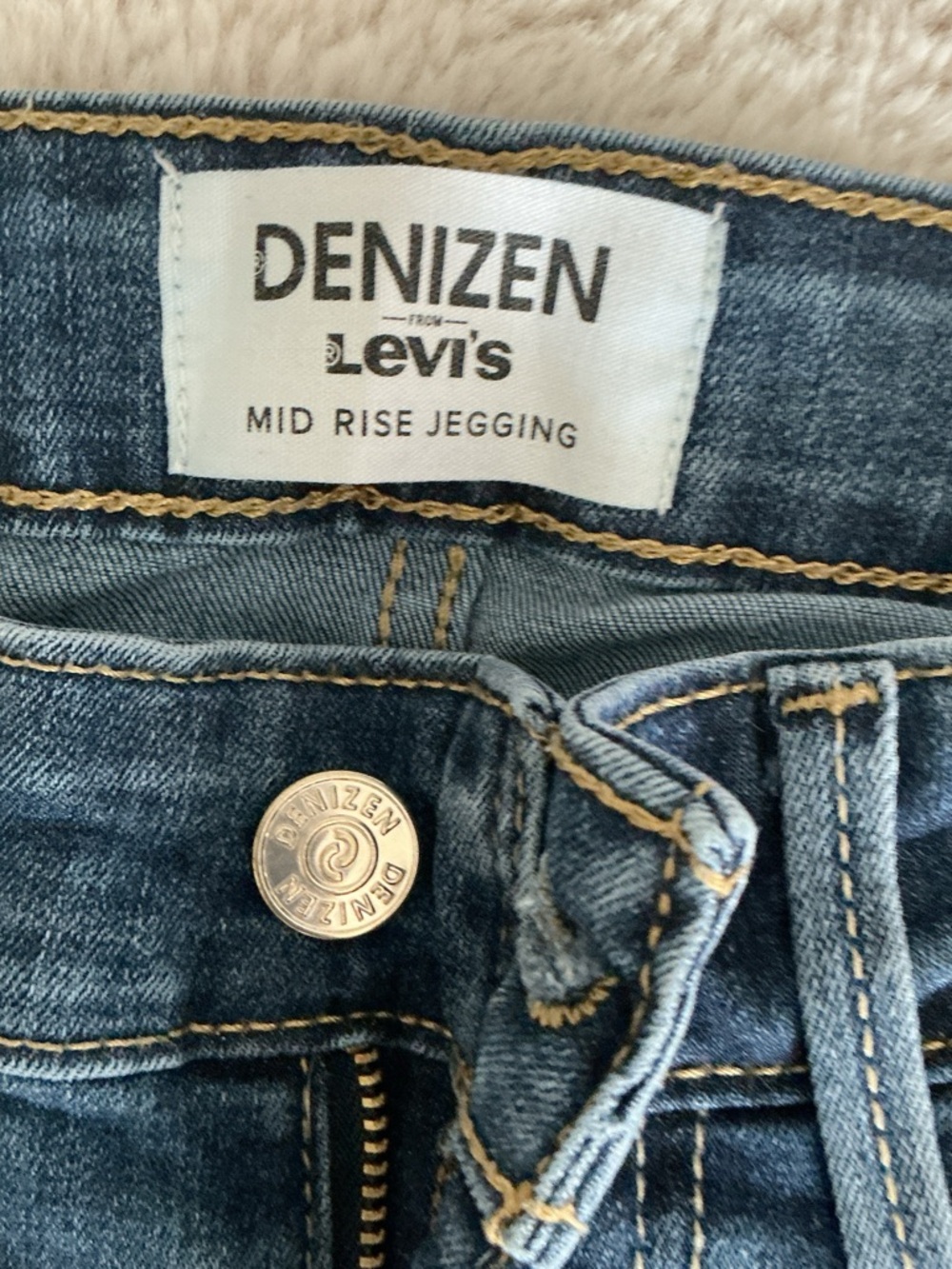 Denizen from Levi's Blue Denim Mid Rise Jegging with Gold Stitching